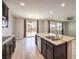 Kitchen island with double sink and stainless steel appliances at 7528 Abby View St, Las Vegas, NV 89166