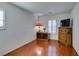 Bright bedroom featuring wood floors and a built-in dresser at 7832 Hamilton Pool Dr, Las Vegas, NV 89113