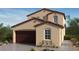 Two-story home with brown garage door and Spanish-style architecture at 79 Tardando Ave, Henderson, NV 89015