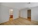Spacious bedroom with wood-look flooring, white walls and multiple doors including bathroom and closet at 9204 Weeping Hollow Ave, Las Vegas, NV 89178