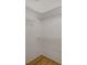 Walk in closet with white wire rack shelving and wood-look flooring at 9204 Weeping Hollow Ave, Las Vegas, NV 89178
