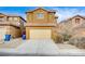 Two-story house with attached garage and desert landscaping at 9204 Weeping Hollow Ave, Las Vegas, NV 89178