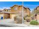 Two-story house with attached garage and mature shrubs at 9204 Weeping Hollow Ave, Las Vegas, NV 89178