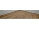 Corner view showing modern wood-look flooring and white baseboards at 9204 Weeping Hollow Ave, Las Vegas, NV 89178