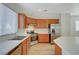 The kitchen features stainless steel appliances, wood cabinets, and lots of counter space at 9204 Weeping Hollow Ave, Las Vegas, NV 89178