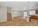 The open floor plan features a staircase, kitchen, and a living area at 9204 Weeping Hollow Ave, Las Vegas, NV 89178