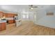 View of kitchen, living room, and staircase in an open floor plan filled with natural light at 9204 Weeping Hollow Ave, Las Vegas, NV 89178