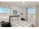 Charming bedroom with rustic wood headboard and window seat at 925 Watford Pl, Henderson, NV 89011