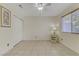 Simple bedroom with tile floors and ample closet space at 9604 Rancho Palmas Dr, Las Vegas, NV 89117