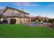 Luxury home with a beautiful pool and expansive grassy backyard at 9605 Verlaine Ct, Las Vegas, NV 89145