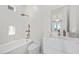 Bathroom with soaking tub, toilet, and modern vanity at 9605 Verlaine Ct, Las Vegas, NV 89145