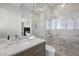 Modern bathroom with marble shower and vanity at 9605 Verlaine Ct, Las Vegas, NV 89145