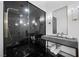 Spa-like bathroom with a large walk-in shower and marble finishes at 9605 Verlaine Ct, Las Vegas, NV 89145