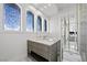 Elegant bathroom with stained-glass windows and vanity at 9605 Verlaine Ct, Las Vegas, NV 89145