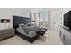 Spacious bedroom with king-size bed and balcony access at 9605 Verlaine Ct, Las Vegas, NV 89145