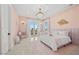 Charming bedroom with pink walls, a crib, and balcony access at 9605 Verlaine Ct, Las Vegas, NV 89145