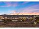 Panoramic city view showcasing the illuminated skyline against a colorful evening sky at 9605 Verlaine Ct, Las Vegas, NV 89145