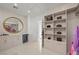 Organized closet with custom shelving and mirror at 9605 Verlaine Ct, Las Vegas, NV 89145