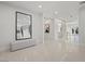 Bright and spacious entryway with large mirror and bench at 9605 Verlaine Ct, Las Vegas, NV 89145