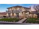 Elegant two-story home with a welcoming entryway and landscaping at 9605 Verlaine Ct, Las Vegas, NV 89145
