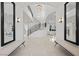 Grand foyer features tile flooring, soaring ceilings, custom lighting and a curved staircase at 9605 Verlaine Ct, Las Vegas, NV 89145