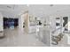 Modern kitchen with large island, contemporary cabinetry, and wine storage at 9605 Verlaine Ct, Las Vegas, NV 89145