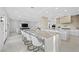 Gourmet kitchen with expansive island, high-end stainless steel appliances, and marble countertops at 9605 Verlaine Ct, Las Vegas, NV 89145