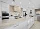 Modern kitchen with island, stainless steel appliances, and marble countertops at 9605 Verlaine Ct, Las Vegas, NV 89145
