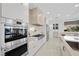 High-end kitchen with stainless steel appliances and marble backsplash at 9605 Verlaine Ct, Las Vegas, NV 89145