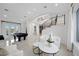 Spacious living area with pool table, comfortable seating and a view at 9605 Verlaine Ct, Las Vegas, NV 89145