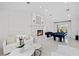 Open living space with a modern fireplace, pool table, and ample natural light at 9605 Verlaine Ct, Las Vegas, NV 89145