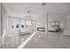 Luxurious main bedroom with fireplace, sitting area and large windows at 9605 Verlaine Ct, Las Vegas, NV 89145