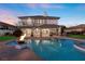 Inviting pool with fire pit and outdoor entertaining space at 9605 Verlaine Ct, Las Vegas, NV 89145