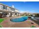 Inviting kidney-shaped pool with ample patio space at 9605 Verlaine Ct, Las Vegas, NV 89145