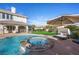 Relaxing backyard oasis featuring a sparkling pool, hot tub, and patio at 9605 Verlaine Ct, Las Vegas, NV 89145