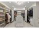 Large walk-in closet, custom shelving and island at 9605 Verlaine Ct, Las Vegas, NV 89145