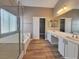 Elegant bathroom with double vanity, soaking tub, and walk-in shower at 10279 Montes Vascos Dr, Las Vegas, NV 89178