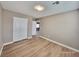 Spacious bedroom featuring wood-look floors and a double-door closet at 10279 Montes Vascos Dr, Las Vegas, NV 89178