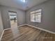 Bedroom with hardwood floors and view into kitchen at 10279 Montes Vascos Dr, Las Vegas, NV 89178