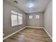Bright bedroom with large window and hardwood floors at 10279 Montes Vascos Dr, Las Vegas, NV 89178