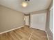 Bright bedroom with wood-look floors and double-door closet at 10279 Montes Vascos Dr, Las Vegas, NV 89178