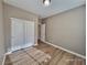 Bedroom with double doors and hardwood floors at 10279 Montes Vascos Dr, Las Vegas, NV 89178