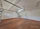 Spacious garage with painted floor and extra storage at 10279 Montes Vascos Dr, Las Vegas, NV 89178