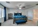 Main bedroom with king-size bed, blue bedding, and a dark gray dresser at 10467 Joaquin Fire St, Las Vegas, NV 89141