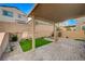 Relaxing backyard with covered patio and artificial turf at 10631 Enridge Ave, Las Vegas, NV 89166