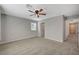 Well-lit bedroom with ceiling fan and ensuite access at 10631 Enridge Ave, Las Vegas, NV 89166