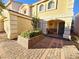 Front porch with a bench and brick flooring at 1142 Sax Fifth Ave, Henderson, NV 89052