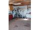 Workshop with tools, bicycle, and plywood flooring at 1450 Fern St, Pahrump, NV 89060