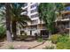 Exterior view of a multi-story building with lush landscaping and balconies at 205 E Harmon Ave # 609, Las Vegas, NV 89169