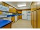 Bright kitchen, white appliances, and wood cabinets at 205 E Harmon Ave # 609, Las Vegas, NV 89169